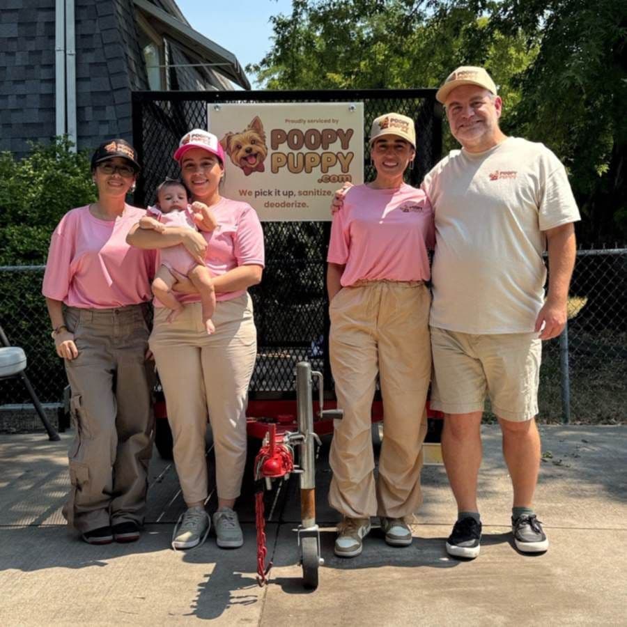 The Sanders family - the Layton crew behind Poopy Puppy - in front of their branded trailer