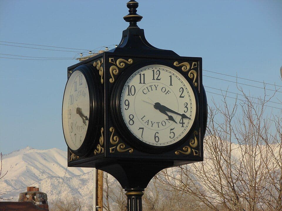 The City of Layton street clock against the Wasatch foothills