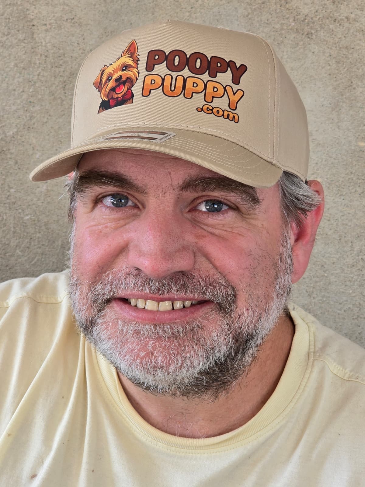 Benji Sanders, Poopy Puppy founder, in a Poopy Puppy hat